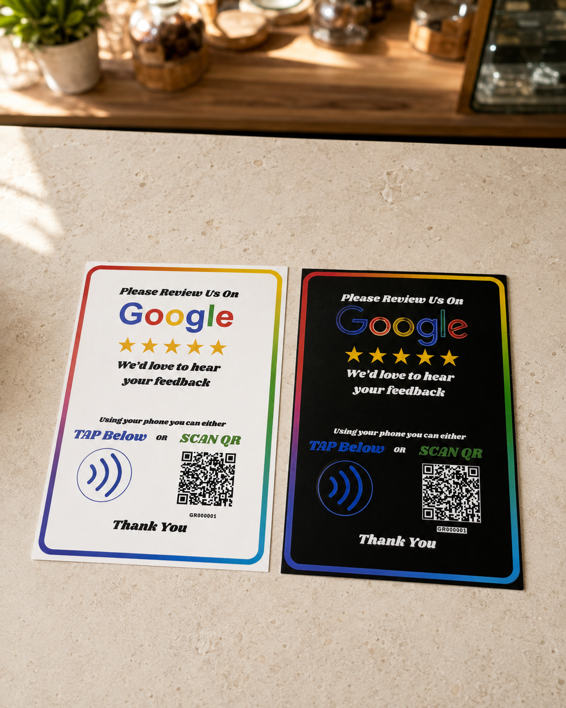 White and black Google Review Plaques on a business countertop